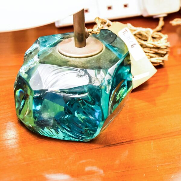 A pair of table lamps, with brass structure on cut glass pedestals with white satin blown glass shades designed by Roberto Giulio Rida