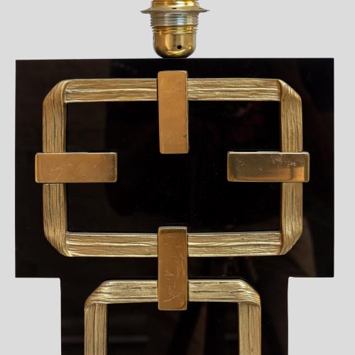 A black perspex with brass deco table lamps by Frigerio