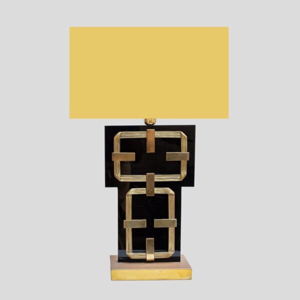 A black perspex with brass deco table lamps by Frigerio