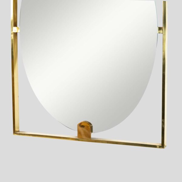 Mid-century style rectangular brass frame with oval mirror