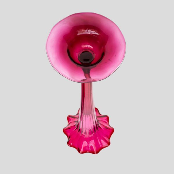 A Tall ruby color blown glass flared single trumpet shape