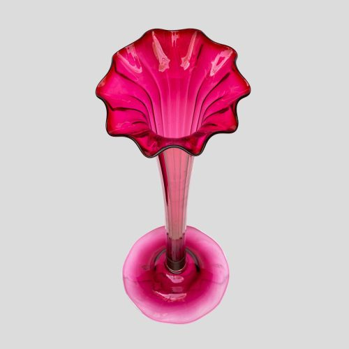A Tall ruby color blown glass flared single trumpet shape