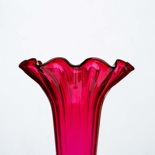 A Tall ruby color blown glass flared single trumpet shape