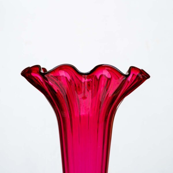 A Tall ruby color blown glass flared single trumpet shape