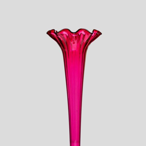 A Tall ruby color blown glass flared single trumpet shape