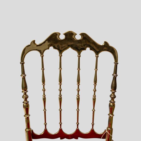 Red velvet upholstered brass metal chairs by Chiavari
