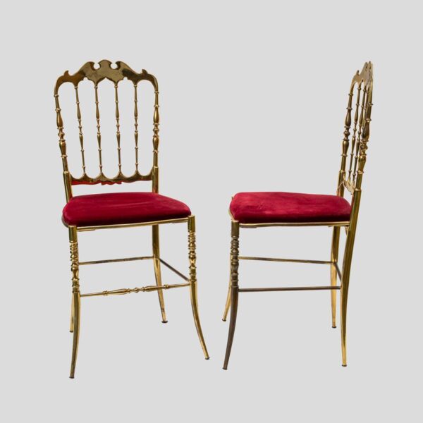 Red velvet upholstered brass metal chairs by Chiavari