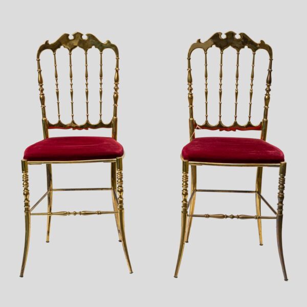 Red velvet upholstered brass metal chairs by Chiavari