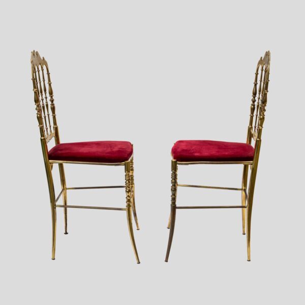 Red velvet upholstered brass metal chairs by Chiavari