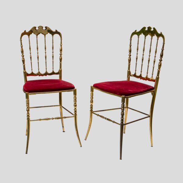 Red velvet upholstered brass metal chairs by Chiavari