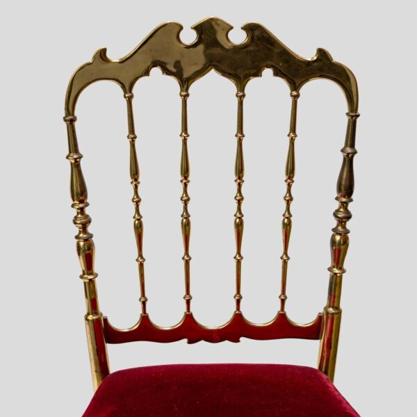 Red velvet upholstered brass metal chairs by Chiavari