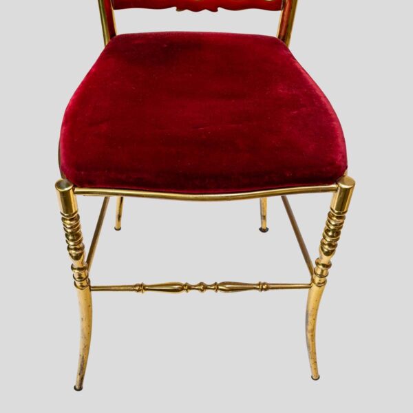 Red velvet upholstered brass metal chairs by Chiavari